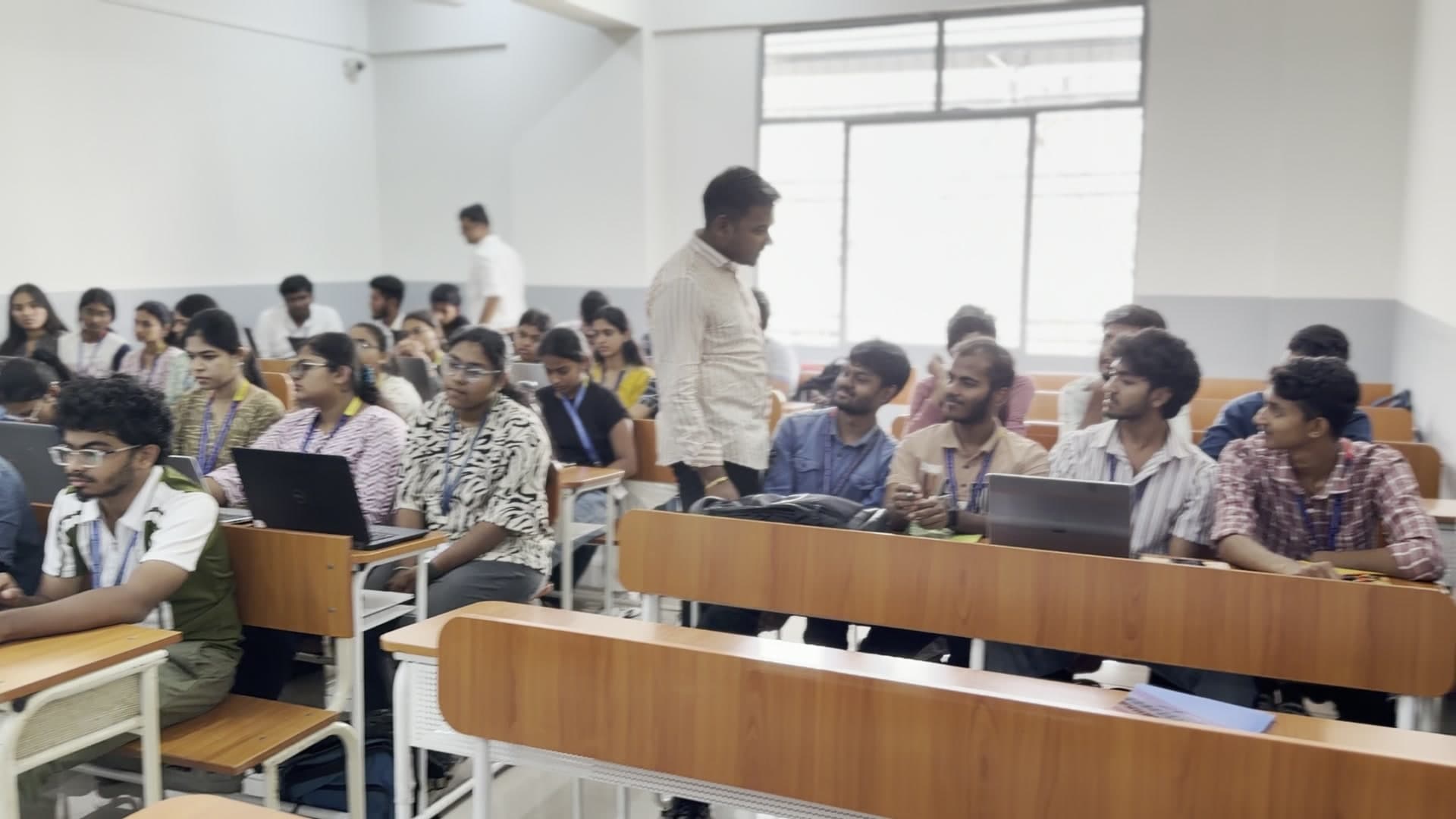 A wide view of the workshop class with learners and their laptops